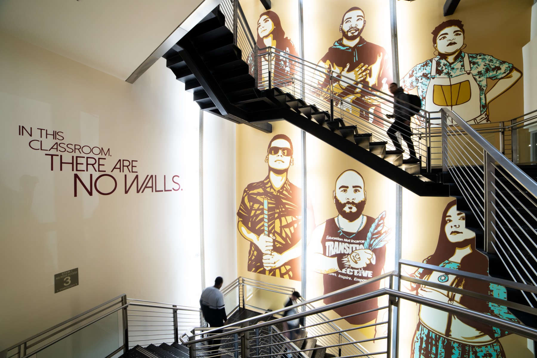 University Library stairwell mural that reads, "In this classroom there are no walls."